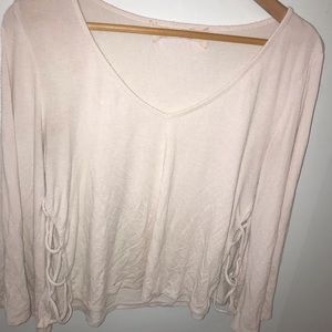 White top with flare sleeves and string detail